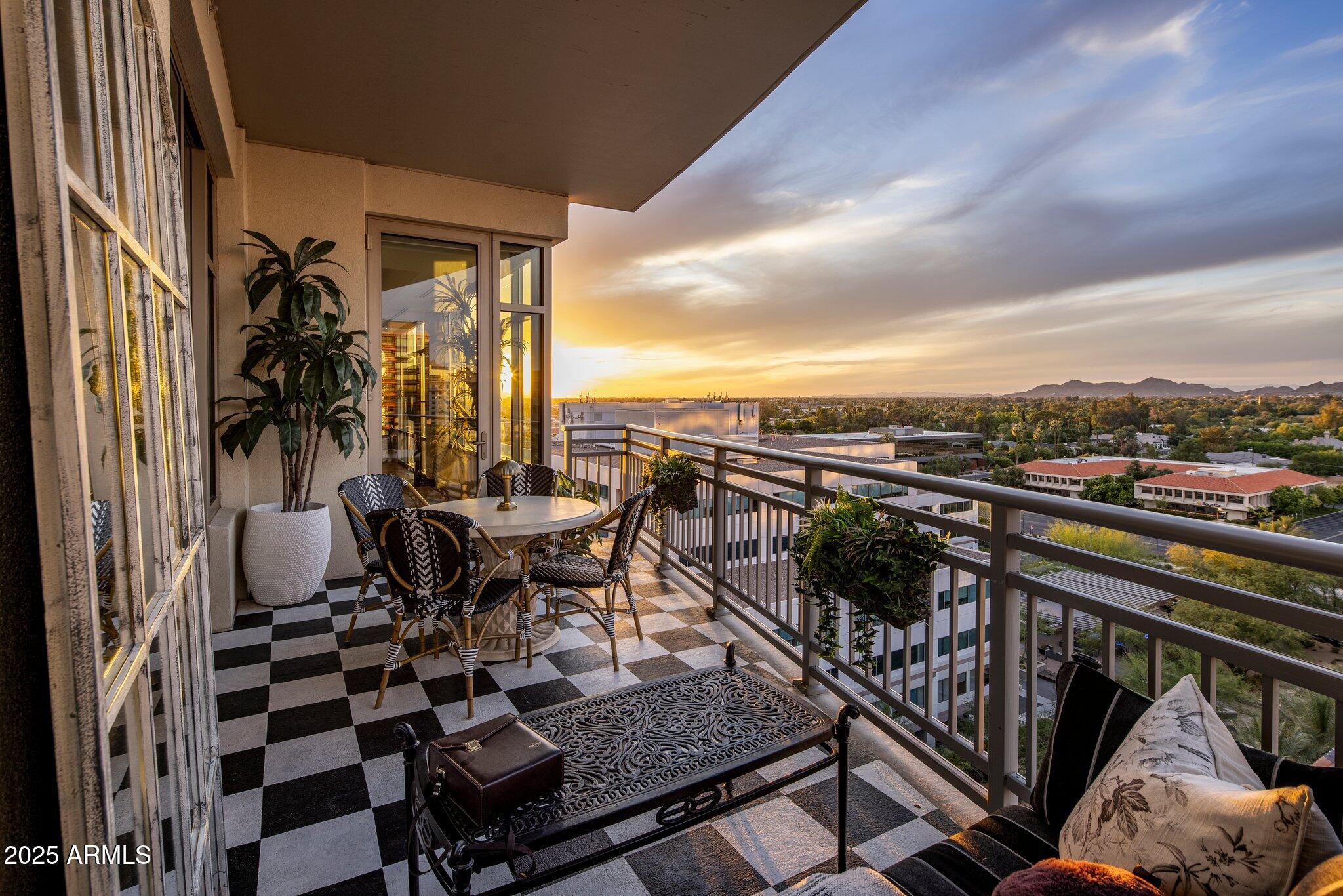 2211 East Camelback Road, Unit 902 Phoenix, AZ 85016 - Photo 36 of 37 a view of a chairs and table in the balcony