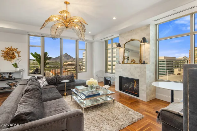 a living room with furniture fireplace and a fireplace