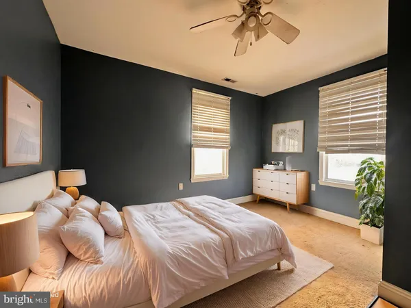 a view of room with window and ceiling fan