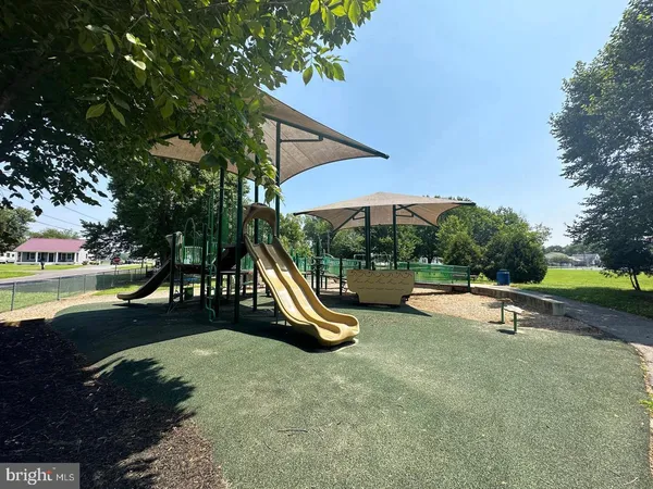 a view of a swimming pool with a yard