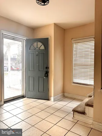 a view of a room that has a bed and a window in it
