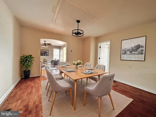 a view of a room with wooden floor and windows