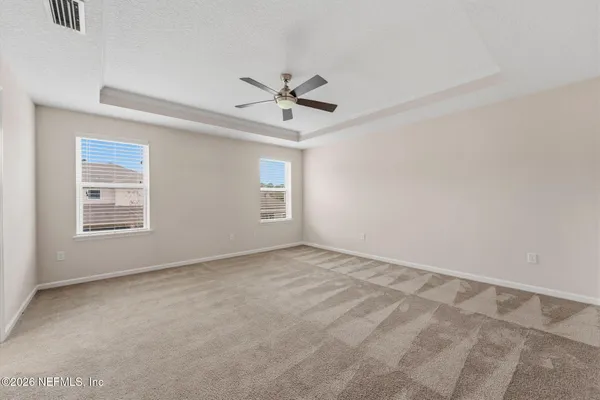 a bedroom with a bed and chair