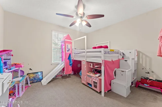 a bedroom with a bed and cabinets