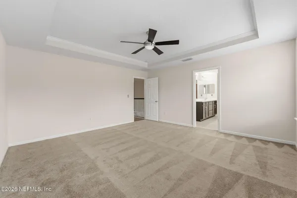 a bathroom with a double vanity sink a toilet and a shower