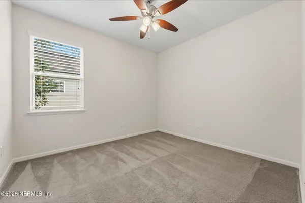 a white bath tub sitting next to a white toilet