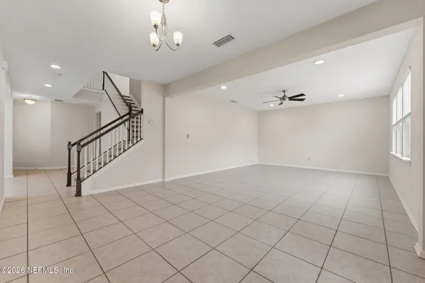 a view of a kitchen with a sink and a stove top oven