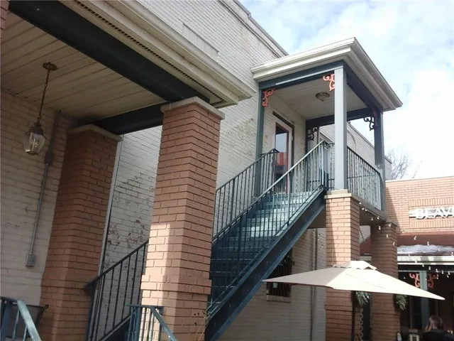 a view of front door with wooden floor