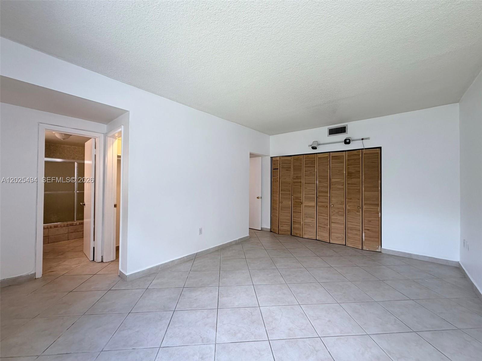 9159 Southwest 77th Avenue, Unit 112 Miami, FL 33156 - Photo 28 of 38 an empty room with a empty space