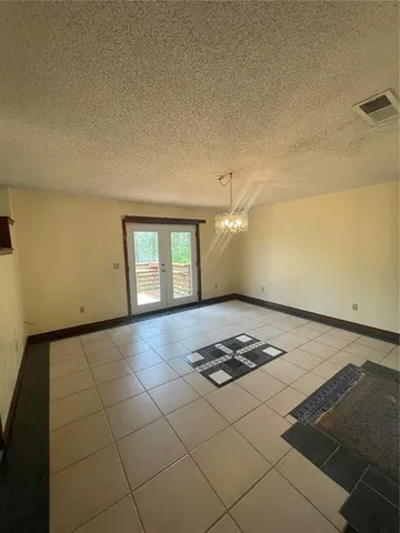 a view of balcony with wooden floor and fence