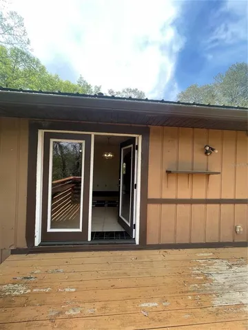 a kitchen with refrigerator and cabinets