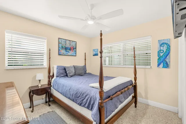 a bedroom with a bed and a table