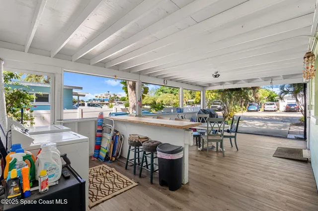 a living room with lots of furniture and a wooden floor