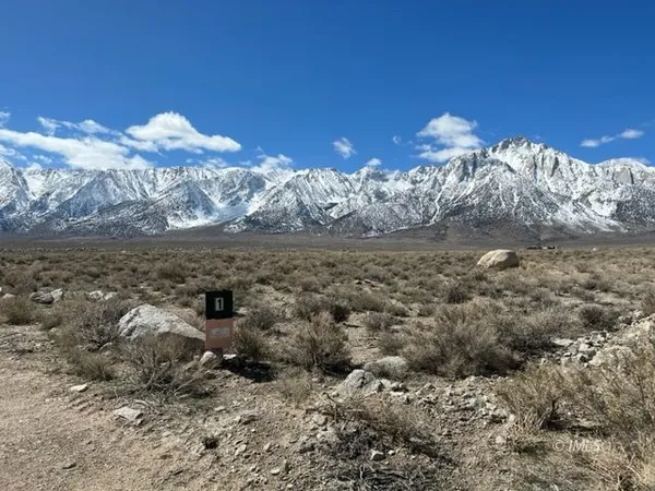 a view of a of mountains in middle of the background