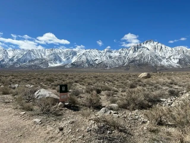 a view of a of mountains in middle of the background