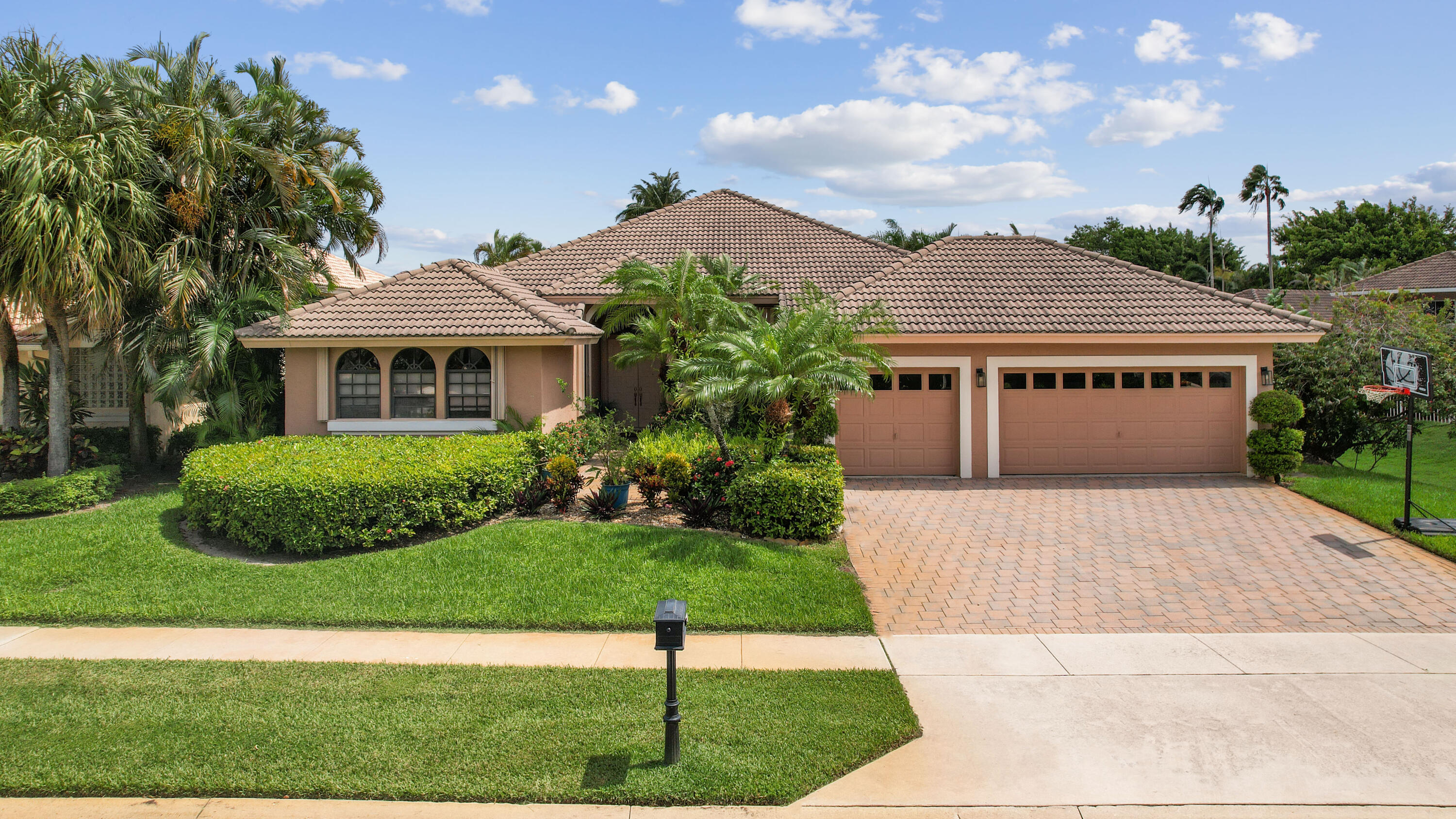 7726 La Corniche Circle Boca Raton, FL 33433 - Photo 1 of 27 a front view of a house with a yard