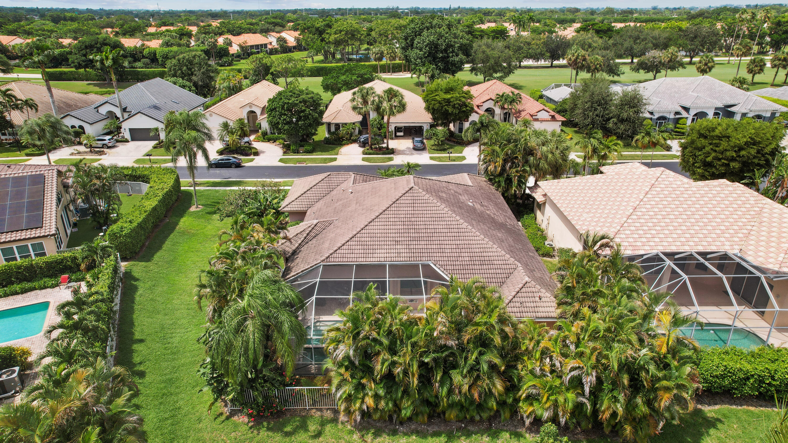 7726 La Corniche Circle Boca Raton, FL 33433 - Photo 25 of 27 an aerial view of multiple houses with a yard