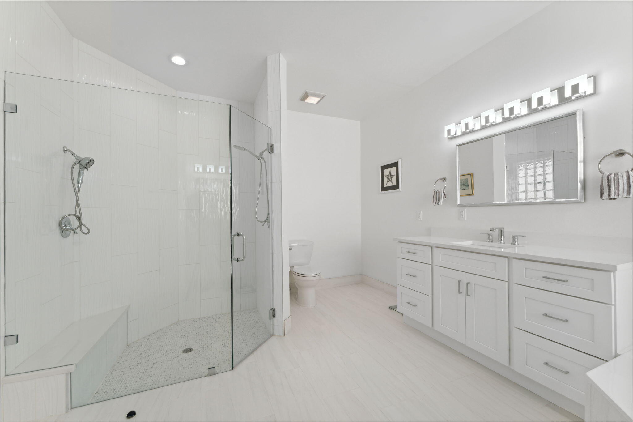 7726 La Corniche Circle Boca Raton, FL 33433 - Photo 10 of 27 a bathroom with a double vanity sink toilet and shower