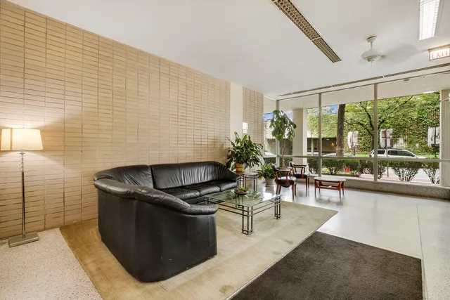 a view of a porch with a table and chairs