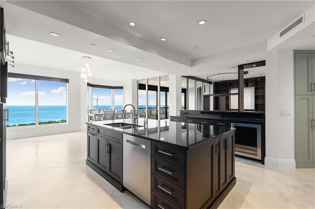 a kitchen with stainless steel appliances granite countertop a stove and cabinets