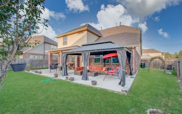 a view of living room with yard and outdoor seating
