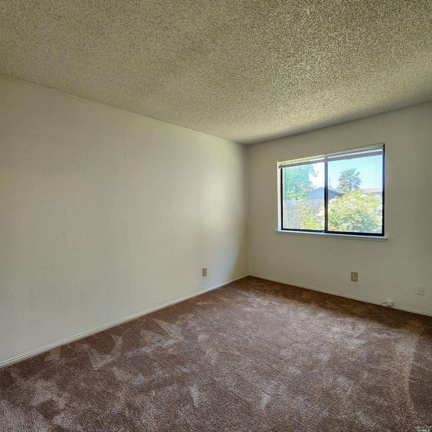 1024 Scott Street Fairfield, CA 94533 - Photo 7 of 9 an empty room with a window