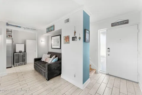 a living room with furniture and a rug