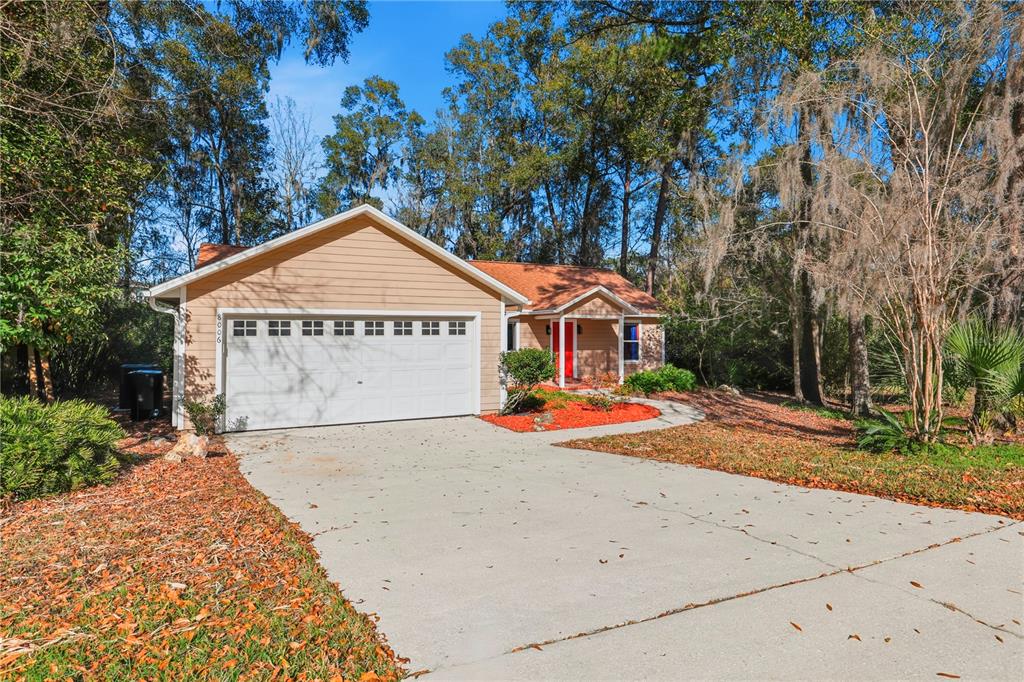 8006 Southwest 62 Lane Gainesville, FL 32608 - Photo 16 of 17 a view of garage with wooden fence