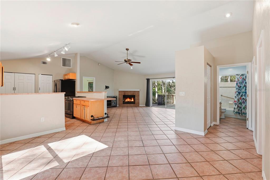 8006 Southwest 62 Lane Gainesville, FL 32608 - Photo 3 of 17 a view of a kitchen with furniture and a chandelier