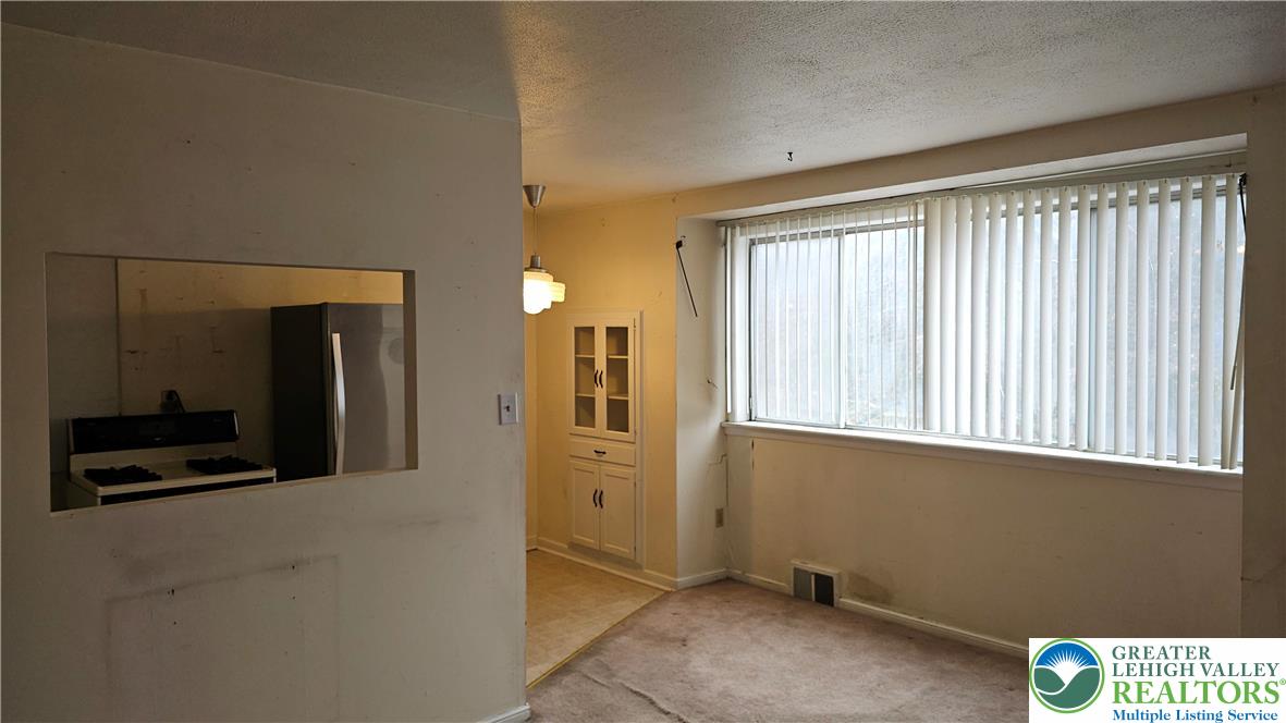 2335 4th Street Wilson, PA 18042 - Photo 11 of 48 a view of an empty room with kitchen and a window