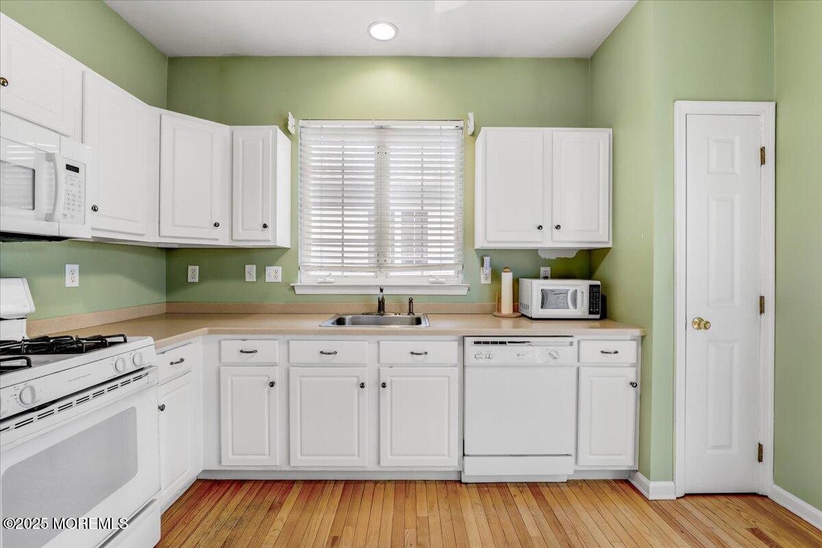 21 Shelley Road Brick, NJ 08724 - Photo 12 of 32 a kitchen with granite countertop white cabinets and a stove