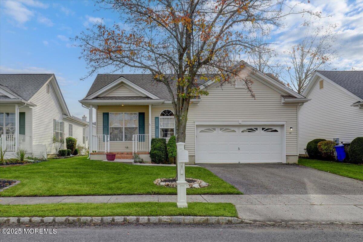 21 Shelley Road Brick, NJ 08724 - Photo 4 of 32 a front view of a house with a yard and garage