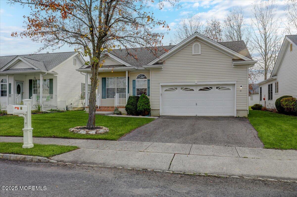 21 Shelley Road Brick, NJ 08724 - Photo 5 of 32 a front view of a house with a yard and garage