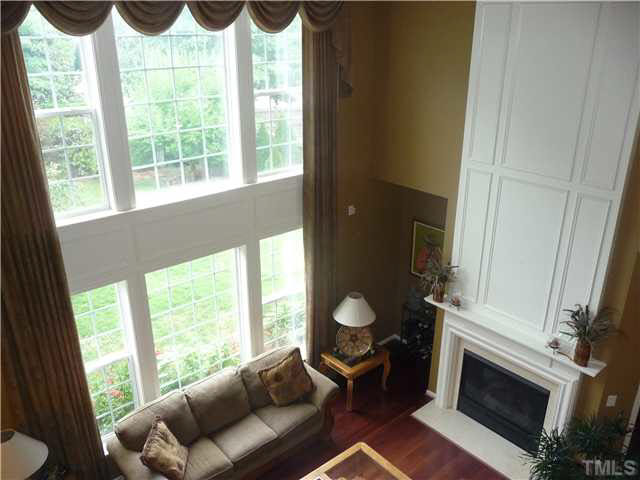 7624 Silver View Lane Raleigh, NC 27613 - Photo 11 of 25 a living room with furniture and a fireplace