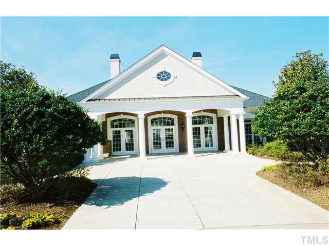 7624 Silver View Lane Raleigh, NC 27613 - Photo 19 of 25 a view of a white house with a yard