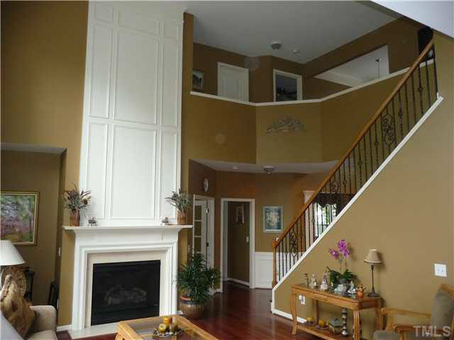 7624 Silver View Lane Raleigh, NC 27613 - Photo 4 of 25 a living room with furniture and a fireplace