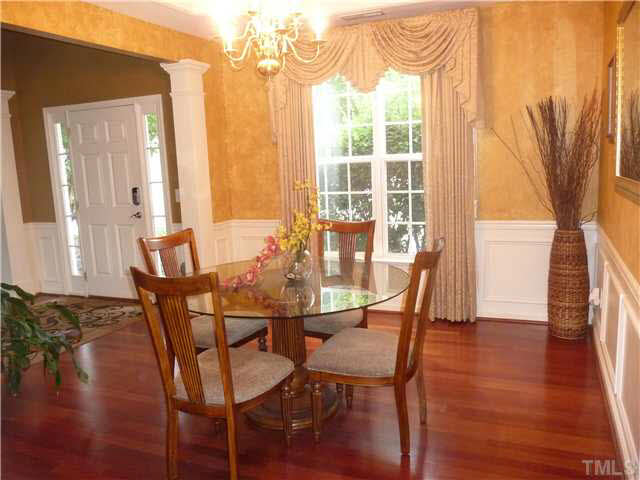 7624 Silver View Lane Raleigh, NC 27613 - Photo 5 of 25 a dining room with furniture and wooden floor