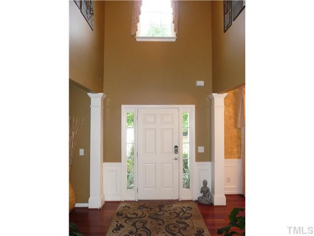 7624 Silver View Lane Raleigh, NC 27613 - Photo 6 of 25 a bedroom with a bed and a table