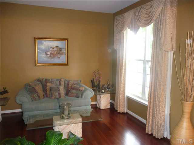 7624 Silver View Lane Raleigh, NC 27613 - Photo 7 of 25 a living room with furniture and a window
