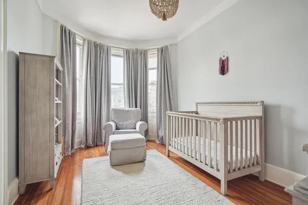 a bedroom with furniture and a window
