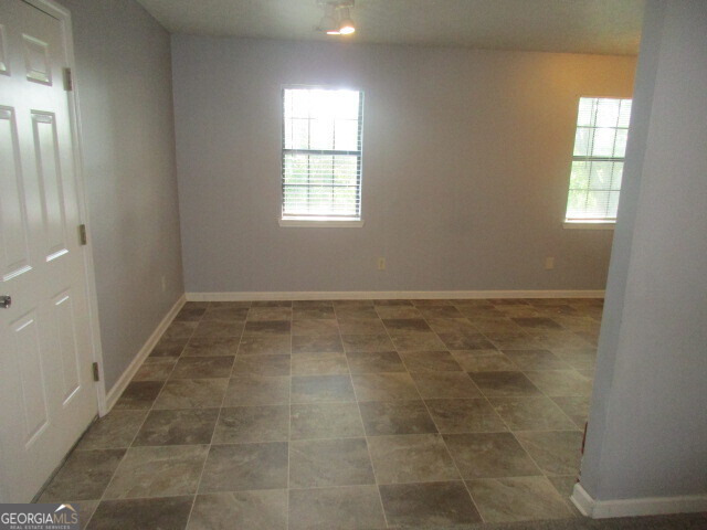 625 Strickland Road Locust Grove, GA 30248 - Photo 4 of 11 a view of an empty room and window