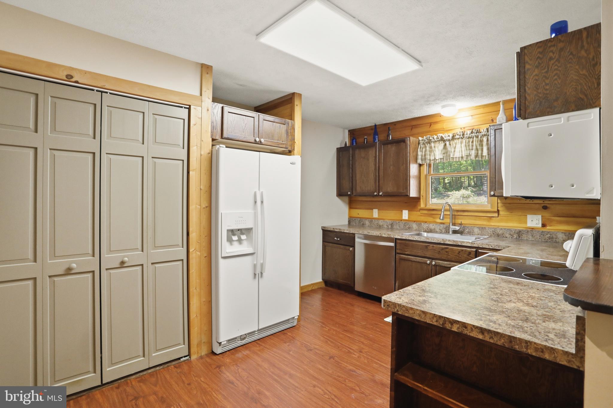 1400 Core Road Romney, WV 26757 - Photo 43 of 73 a kitchen with stainless steel appliances granite countertop a refrigerator and a stove top oven