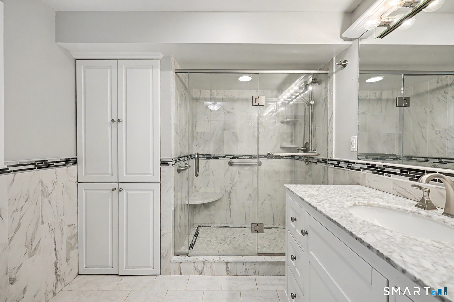 19 Geneva Road Norwalk, CT 06850 - Photo 25 of 33 a bathroom with a granite countertop sink mirror and shower