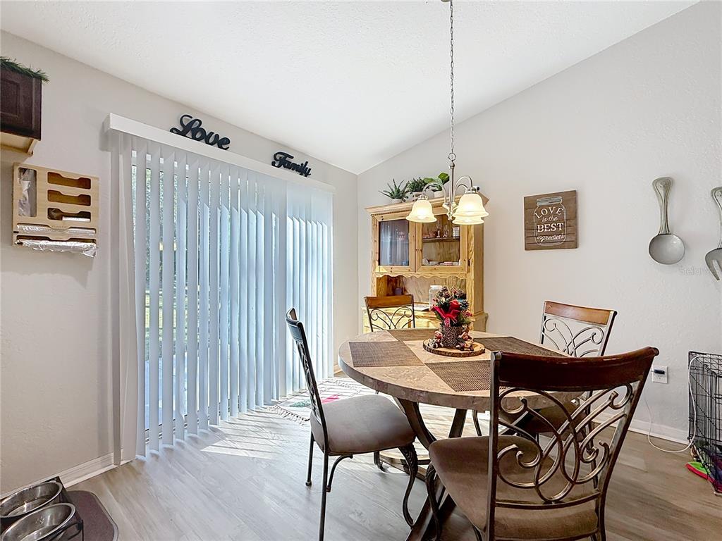 6188 East Seneca Street Inverness, FL 34452 - Photo 11 of 32 a dining room with furniture and window