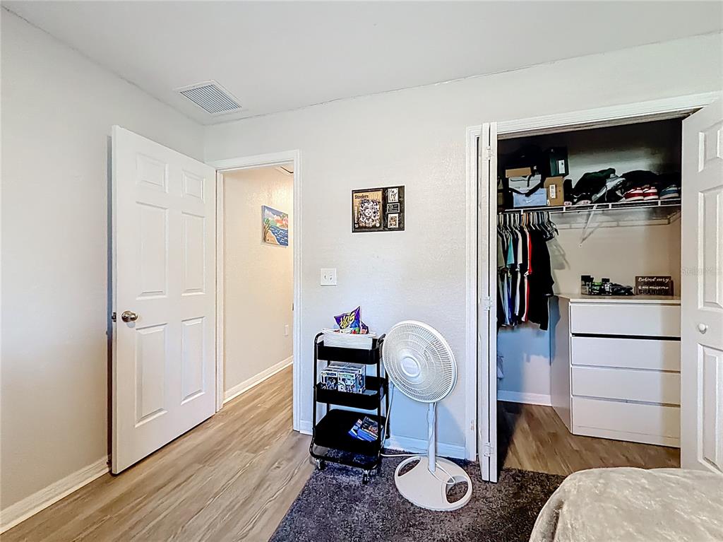 6188 East Seneca Street Inverness, FL 34452 - Photo 15 of 32 a room with furniture and wooden floor