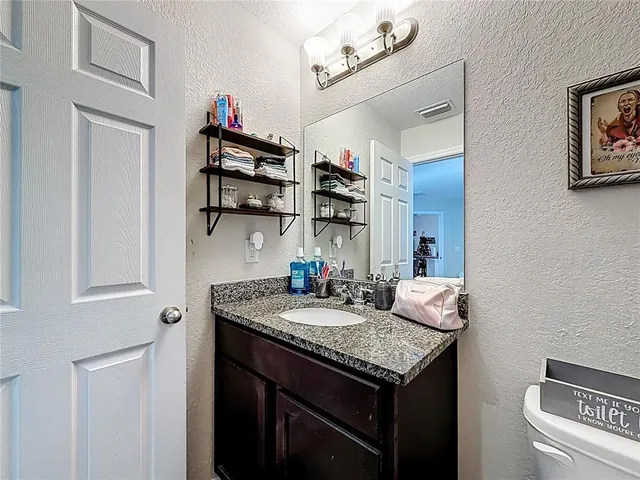 a view of a garage with a bike and car