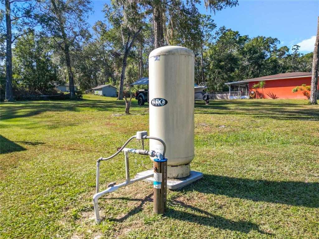 6188 East Seneca Street Inverness, FL 34452 - Photo 32 of 32 a view of a swimming pool with a patio