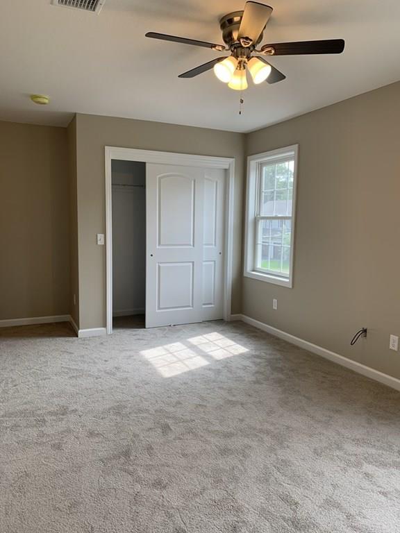 55 Delaware Avenue Springfield, MA 01119 - Photo 14 of 20 an empty room with windows and fan