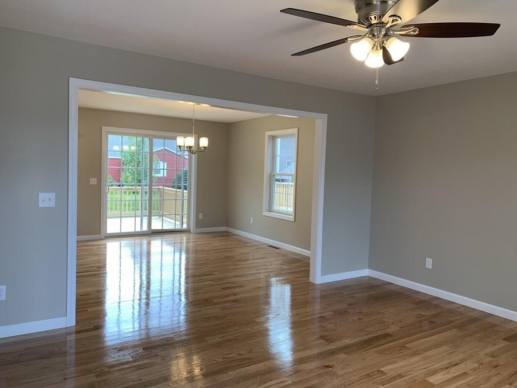 55 Delaware Avenue Springfield, MA 01119 - Photo 6 of 20 a view of an empty room with wooden floor and a window