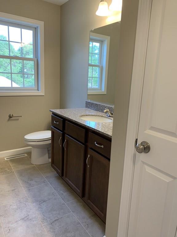 55 Delaware Avenue Springfield, MA 01119 - Photo 7 of 20 a bathroom with a sink a toilet and window